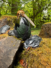 Load image into Gallery viewer, Light gray fossil-textured dragon egg potion bottle with carved labradorite eye charm on mossy stone