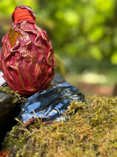 Load image into Gallery viewer, Crimson sculpted dragon egg with gold and copper flame design, bright fiery orange liquid settled, goblet charm