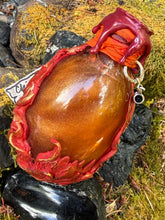 Load image into Gallery viewer, Back view of crimson dragon egg showing sculpted flame texture with gold and copper highlights
