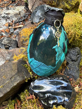 Load image into Gallery viewer, Top-down view of teal gradient dragon egg with black diamond-scale spikes and silver highlights

