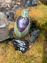 Load image into Gallery viewer, Mottled gray dragon egg potion bottle with bold purple shimmer liquid activated
