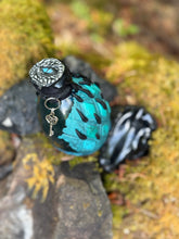 Load image into Gallery viewer, Crimson dragon egg potion bottle with bright fiery orange shimmer liquid activated
