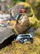 Load image into Gallery viewer, Front view of bronze-brown and green speckled dragon egg with green-golden liquid settled
